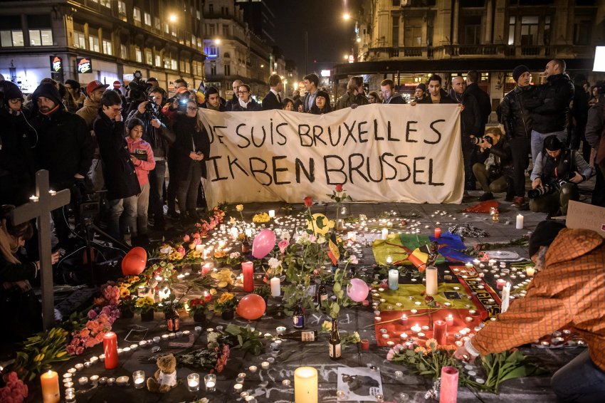People gather to pay tribute to victims in Brussels after terror